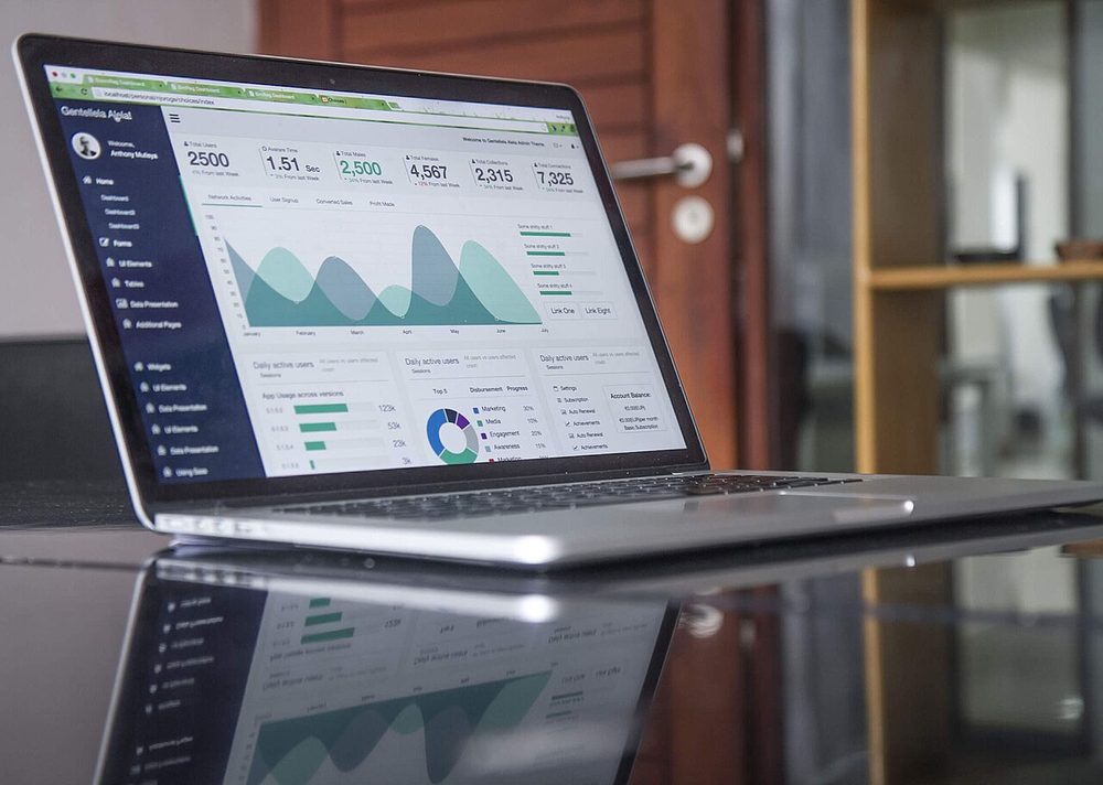 Laptop showing charts and statistics